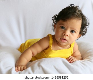 Baby Girl In Yellow Dress For Tummy Time