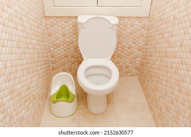 Baby Green Potty In Toilet. Hygiene. Children's Toilet. Children's Pad, Cover, Toilet Seat.