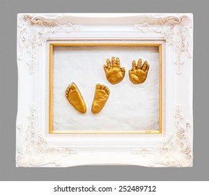 Baby Hand And Foot Print In Gypsum In A Gold Frame.