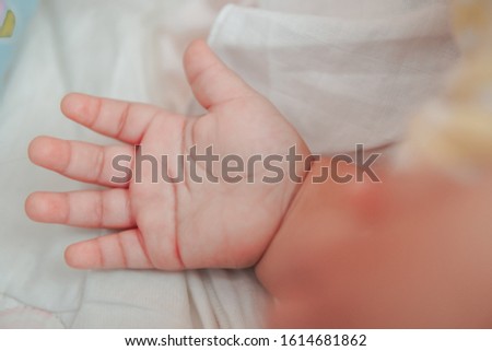 Similar – Baby sleeping on a blanket