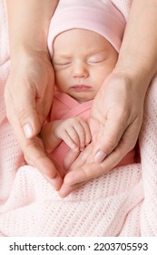 Baby Hand In Mother Palms. Newborn Girl Sleeping With Blanket. Mum Love And Parents Care Concept. Infant Child Face Close Up Portrait In Mother's Hands