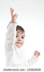 Baby With A Hand Up On A White Isolated Background