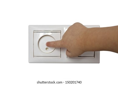 Baby Hand Reaching For An Electrical Outlet Covered With White Safety Plugs (baby And Child Safety Concept)