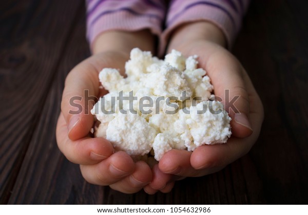 Baby Hands Holding Cottage Cheese On Stock Photo Edit Now 1054632986