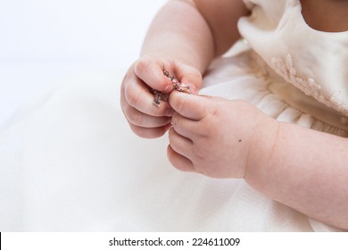 Baby Hands Holding Jewelry I