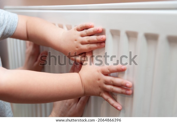 Baby hands measure battery temperature. Usually, the\
heating season in Ukraine starts either from October 15th and\
finishes on April 15th or it can start if the temperature is below\
8C outside. 