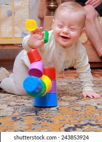 Baby With Happy Face After Pulling Down The Pyramid