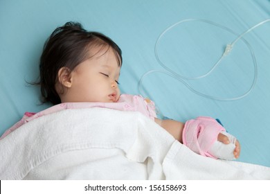 Baby Have Diarrhea And Sleep On A Bed In Hospital With Saline Intravenous (iv)