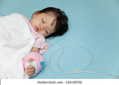 Baby Have Diarrhea And Sleep On A Bed In Hospital With Saline Intravenous (iv)