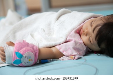 Baby Have Diarrhea And Sleep On A Bed In Hospital With Saline Intravenous (iv)