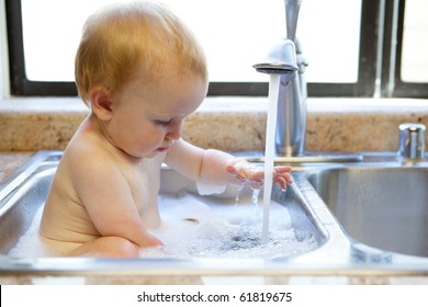 Baby Bathing In Sink Stock Photos Images Photography