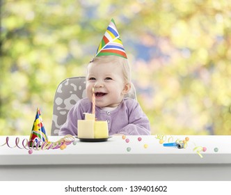 baby having her first birthday, green and yellow blurred background