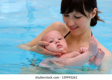 Baby Having Swimming Lesson With Mother