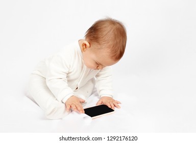 Baby Holding A Mobile Phone Isolated On White Background Generation Z