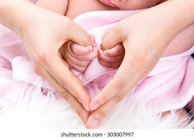 Baby  Holding Mother Making Hearth Symbol Hands With Newborn 3 Month