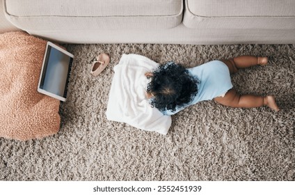 Baby, home and tablet for watching cartoon, child development and top view of floor on lounge. Infant, girl and online entertainment for streaming animation, internet and playing with cozy blanket - Powered by Shutterstock