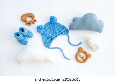 Baby infant hat with booties and kids accessories, flat lay