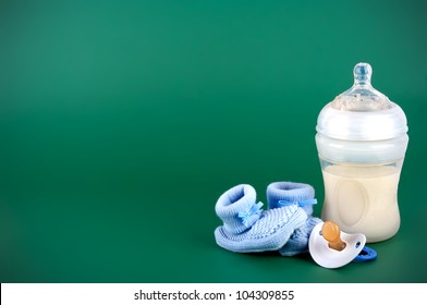 Baby Items On Green Background