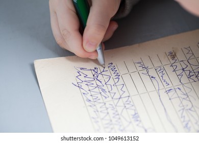  baby kid learns to write pen on paper - Shutterstock ID 1049613152