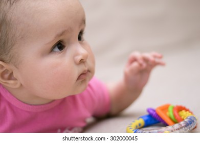 Baby Kid With Toy Rattle