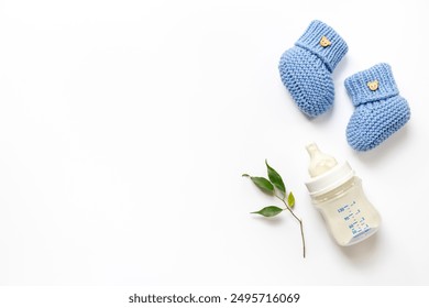 Baby kids flat lay with milk in bottle, top view.