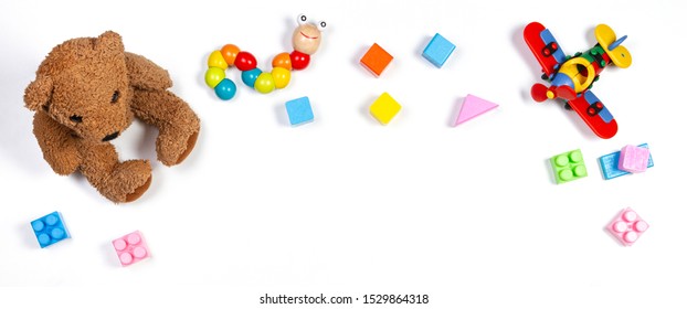 Baby Kids Toys Frame On White Background. Top View, Flat Lay. Copy Space For Text