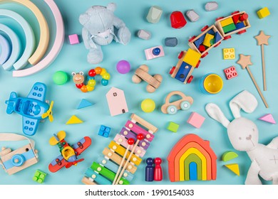 Baby Kids Toys Pattern. Set Of Colorful Educational Wooden And Fluffy Toys On Blue Background. Top View, Flat Lay