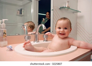 Baby Laughing Sitting in a Sink