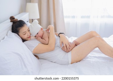 Baby Lay Down On Mom Chest With Love And Warm Feeling, Lullaby Baby On Mother Body In Bedroom.