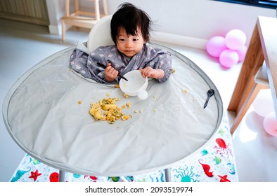 Baby Led Weaning,baby 12 Months Self Eating Cover Of Big Apron And Tray On Highchair.Baby Learn How Holding Folk Spoon And Using A Bowl At Home.