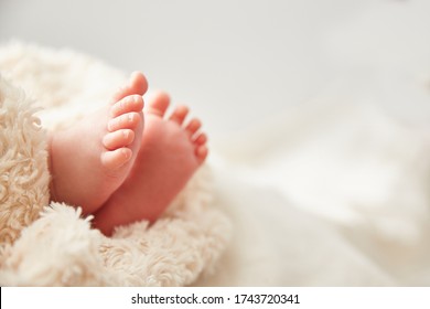 Baby legs close-up. Greeting card with Copyspace. Family concept.