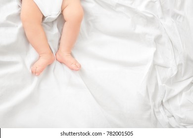 Baby Legs On Bed, Closeup