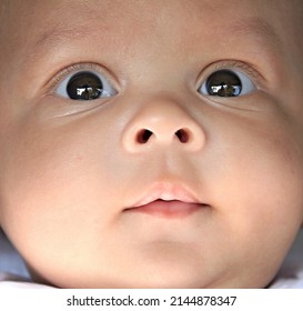 Baby Looking With Big Eyes Just After Having A Good Sleep In Bed Stock Photos