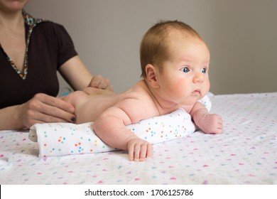 Baby Massage Banner. Young Therapist Giving A Baby Boy A Back Massage. Baby Massage Concept. Infant Baby (2 Month Old) Lying On Tummy. Shallow Depth Of Field. 