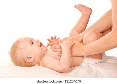 Baby Massage. Mother Massaging Kid Belly, Baby Laughing. Treatment Of Colic. Isolated On White Background