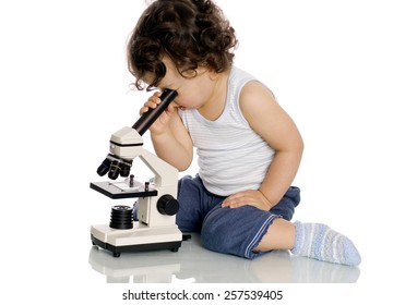 Baby with microscope, isolated on a white background. - Powered by Shutterstock