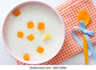 Baby Milk Porridge With Fruits. Kid Pudding Upper View.Semolina.