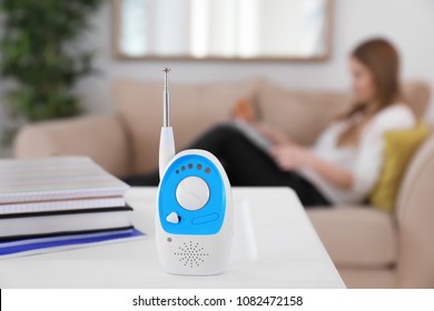 Baby Monitor And Woman On Background. Radio Nanny