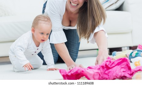 Baby And A Mother On All Fours In Living Room