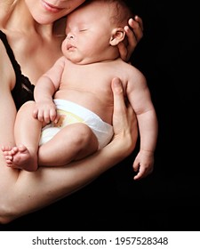 Baby In Mother's Arms And Been Cared For After Having A Good Sleep In Bed Stock Photo 