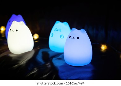 Baby Night Lamp, Five Nightlights In A Row, Different Colors. Children's Night Lights. Night Shooting. Several Lamps On The Couch.