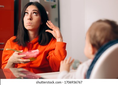 Baby Not Eating And Mother Ignoring Her Protesting. Stressed Mom Fed Up By Fussy Child At Mealtime
