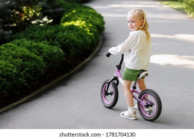 Baby On A Bike In The Park