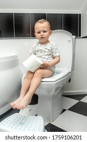 Baby On The Toilet. Caucasian Little Boy With Stomach Ache, Child Holding His Hands On His Belly. Stomach Ache Child.