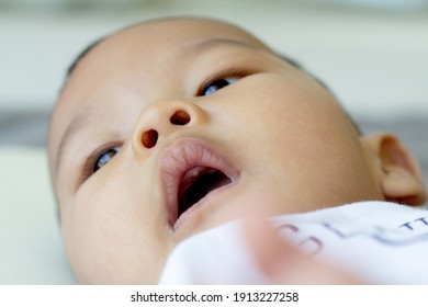 Baby Opens His Mouth Wide During A Check-up At The Dentist.