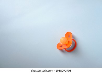 Baby Pacifier On A Blue Background, Top View, Place For An Inscription