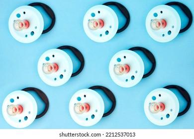 Baby Pacifier On A Blue Background, Close-up. Rubber Pacifier Pattern, Top View