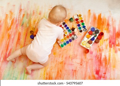 Baby Is Painting A Paint