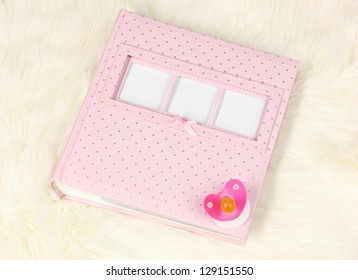 Baby Photo Album On White Carpet