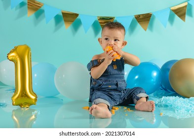 Baby In Photo Session Eating Mango. Baby Photo Session.